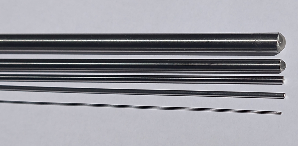 Coated and uncoated catheter mandrels